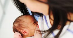Mother breastfeeding her newborn.