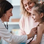 pediatrician with child and mom